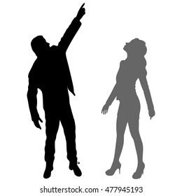 man in jacket pointing up while business woman looking up