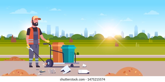 man janitor gathering garbage with iron stick male cleaner pushing trolley cart with rubbish bins cleaning service concept urban park cityscape background horizontal flat