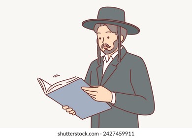 Man in jewish traditional clothing reads book or business documents and shows surprised emotions. Religious talmud in hands of religious guy studying judaism to achieve career success