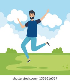 man jumping in the park with blouse and jean