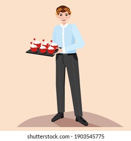 Man in the kitchen cooking cap cakes for his girlfriend. Valentine's day surprise.