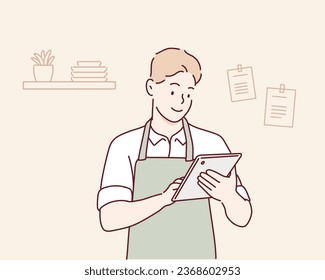 man in the kitchen reading on tablet. Hand drawn style vector design illustrations.