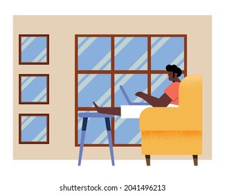 man with laptop in couch at home