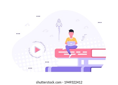 Man with laptop sitting on book stack