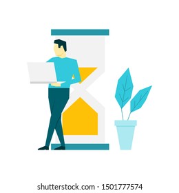 Man with laptop standing near big hourglass