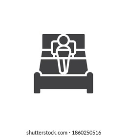 Man with laptop working on bed vector icon. filled flat sign for mobile concept and web design. Work from home glyph icon. Symbol, logo illustration. Vector graphics