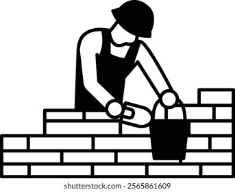 A man is laying bricks and holding a bucket. Concept of hard work and manual labor