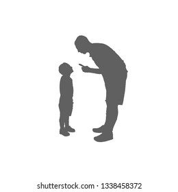 The man leaned over the boy and threatened him with a finger. Father and son silhouette.