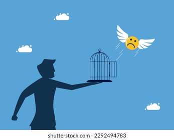 man let the sad face icon fly out of the cage. Liberation of pessimism and freedom
