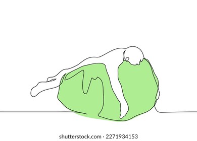 man lies belly down on an armchair pillow - one line drawing vector. concept fatigue, wallow, procrastination