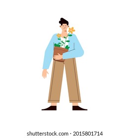 man lifting flowers in houseplant
