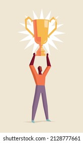 Man lifting a victory trophy