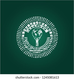 man lifting world icon with chalkboard texture