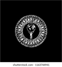 man lifting world icon drawn on blackboard