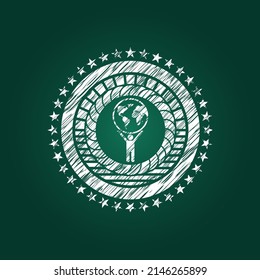 hombre levantando icono mundial dibujado con textura de pizarra. 
