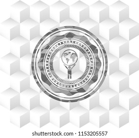 man lifting world icon inside retro style grey emblem with geometric cube white background