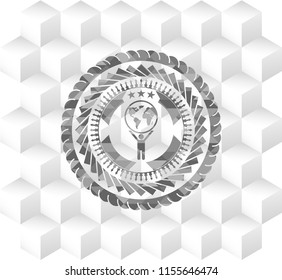 man lifting world icon inside grey badge with geometric cube white background