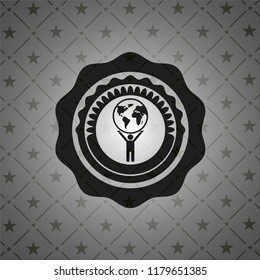 man lifting world icon inside realistic dark emblem