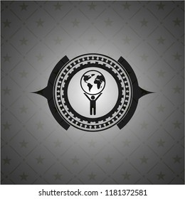 man lifting world icon inside dark badge or emblem
