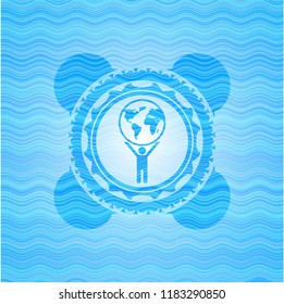 man lifting world icon inside sky blue water wave badge background.