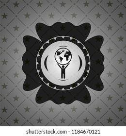man lifting world icon inside dark badge or emblem