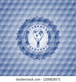man lifting world icon inside blue emblem with geometric pattern background.