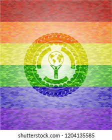 man lifting world icon inside emblem on mosaic background with the colors of the LGBT flag