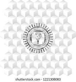 man lifting world icon inside realistic grey emblem with cube white background