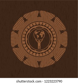 man lifting world icon inside wood emblem. Retro