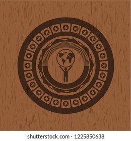 man lifting world icon inside retro wood emblem