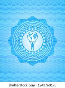 man lifting world icon inside sky blue water style badge.
