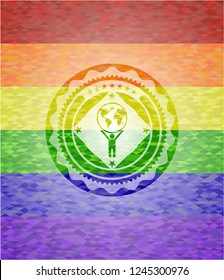 man lifting world icon inside emblem on mosaic background with the colors of the LGBT flag