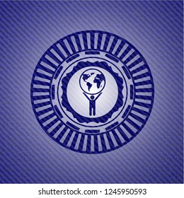 man lifting world icon inside emblem with denim high quality background