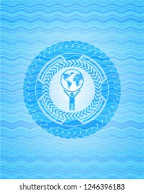 man lifting world icon inside water concept style badge.