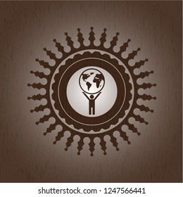 man lifting world icon inside wooden emblem. Retro