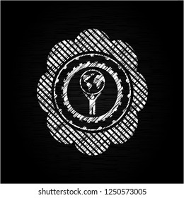 man lifting world icon inside chalkboard emblem