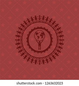 man lifting world icon inside red emblem. Retro