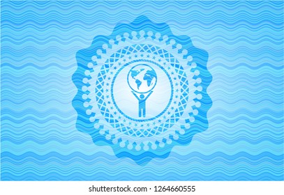 man lifting world icon inside light blue water wave emblem.