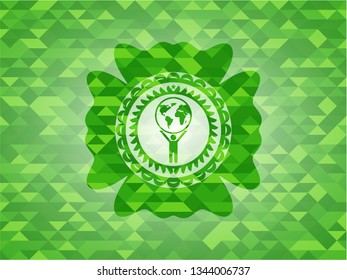 man lifting world icon inside realistic green emblem. Mosaic background