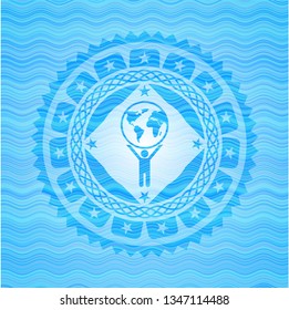 man lifting world icon inside water wave style badge.