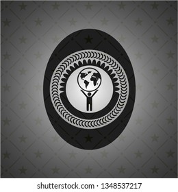 man lifting world icon inside dark emblem. Retro
