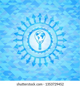 man lifting world icon inside realistic light blue mosaic emblem