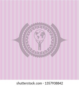 man lifting world icon inside pink emblem. Vintage.