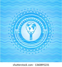man lifting world icon inside water representation badge.