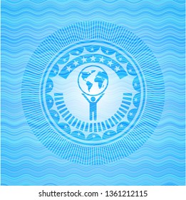 man lifting world icon inside light blue water emblem background.
