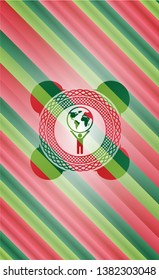 man lifting world icon inside christmas emblem.