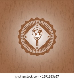 man lifting world icon inside wooden emblem. Retro