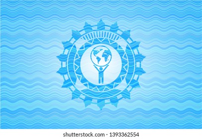 man lifting world icon inside water wave style badge.