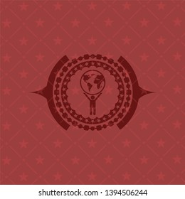man lifting world icon inside retro red emblem