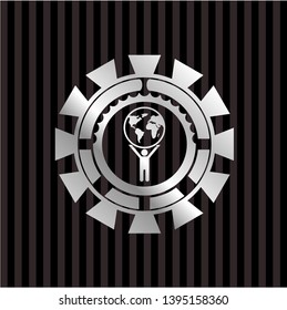 man lifting world icon inside silvery emblem